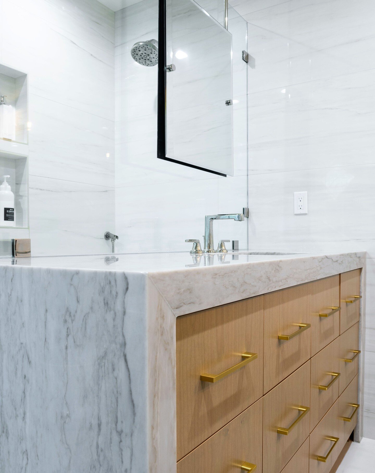 We are HUGE fans of thicker counter fronts and waterfall sides in your bathroom, especially when the stone is meant to be shown off! #bathroomdesign #bathroomremodel #bainbridgeisland #kitsap