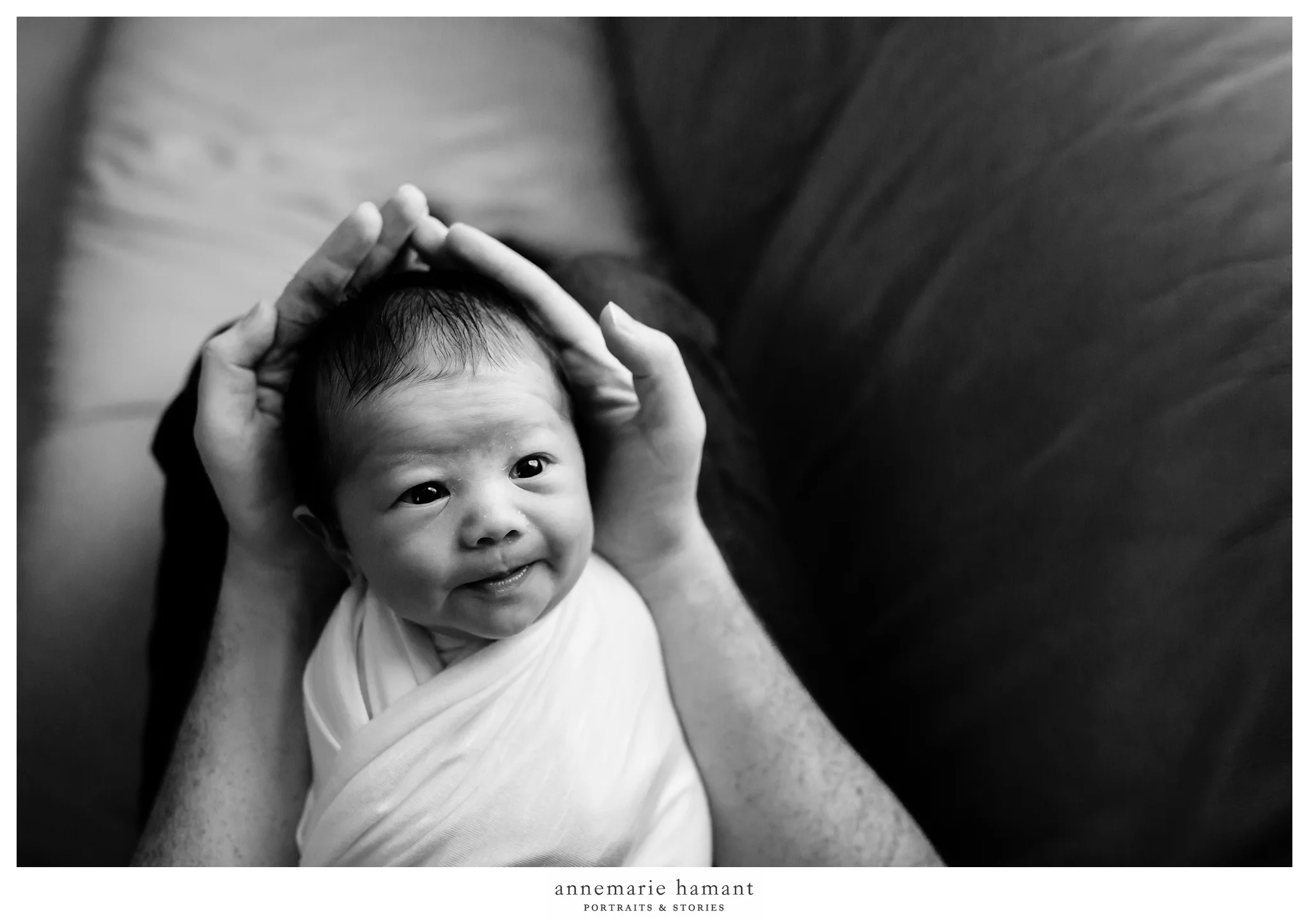 newborn baby in father's hands