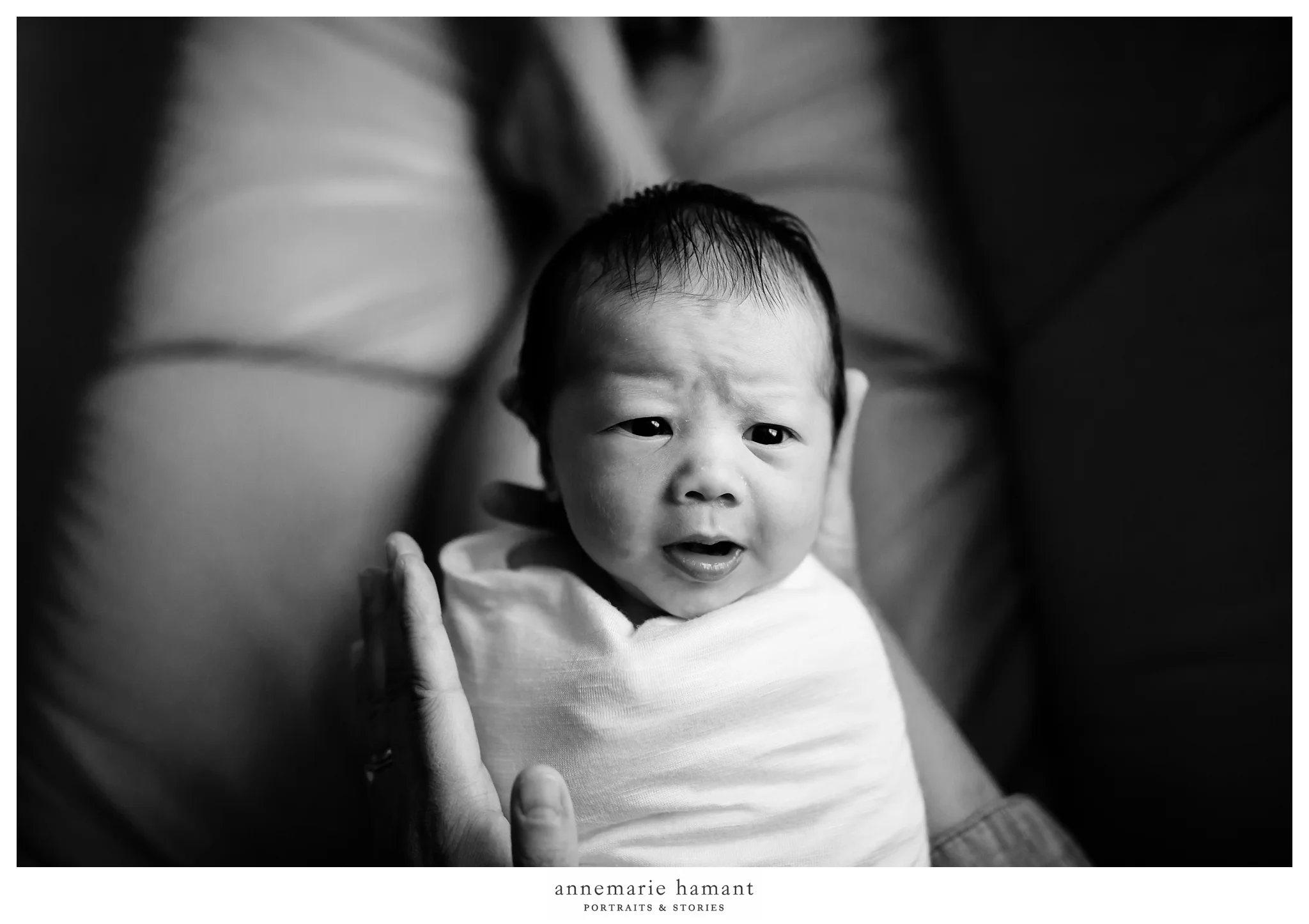 newborn baby in mother's hands