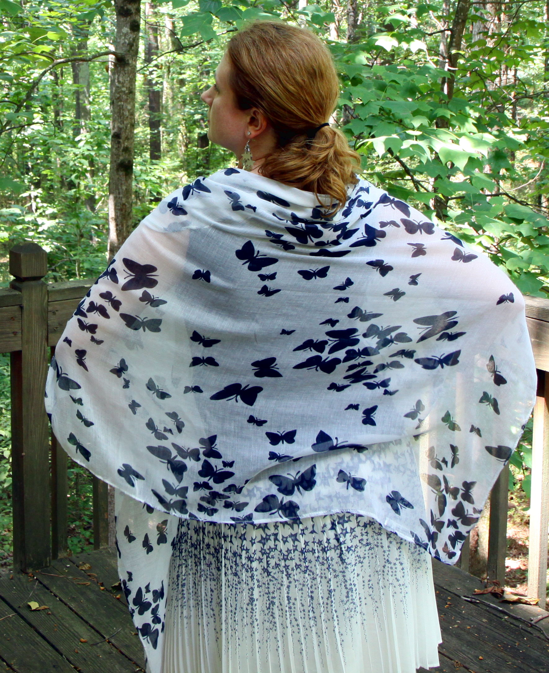 Two prints both in the same two colors with the same main colors in different sizes. Outfit: Butterfly Print Scarf , PLEATED STAR SKIRT, SLEEVELESS DOUBLE DRAPE TEE, AND BOW BALLET FLATS.