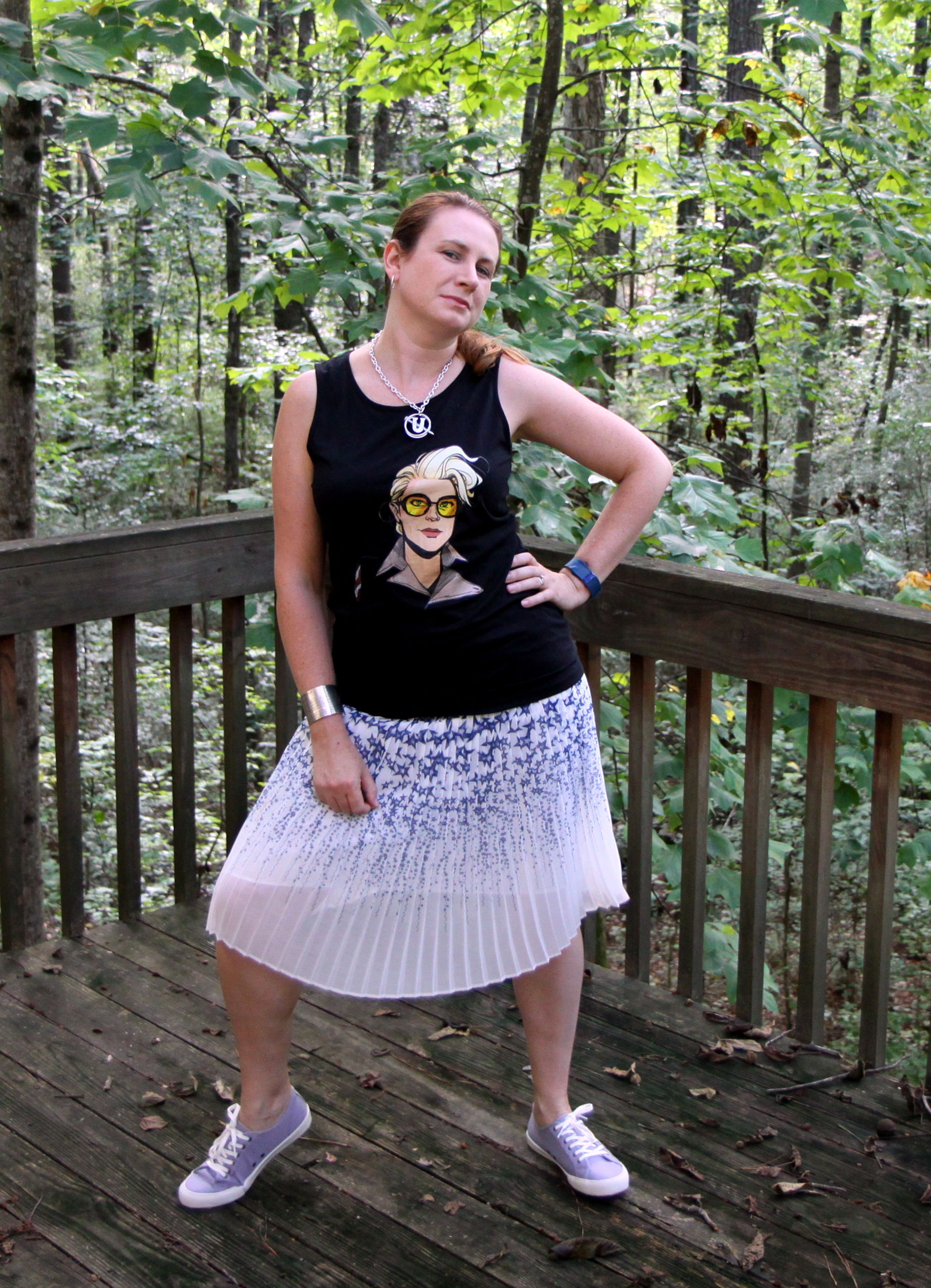 SeaVees sneakers via Stitch Fix , Pleated Star Skirt from Canvas by Land's End, Kate McKinnon Simple Portrait Sleeveless Tank Top by Kazarr from Amazon, Holtzmann's ScrewU Necklace by inspiredbyfandom on Etsy, and the ZAD Silvertone Periodic Table Cuff from Zulily .