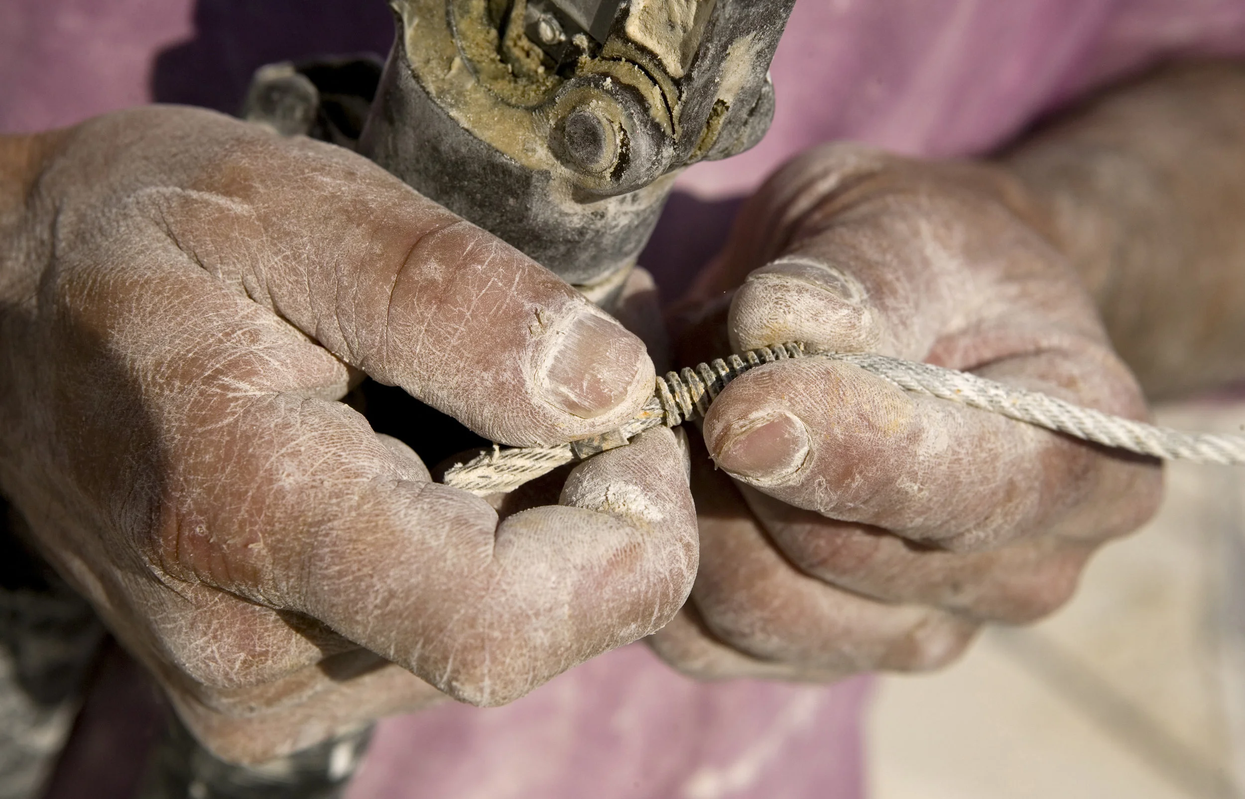 Quarryman hands with diamond rope