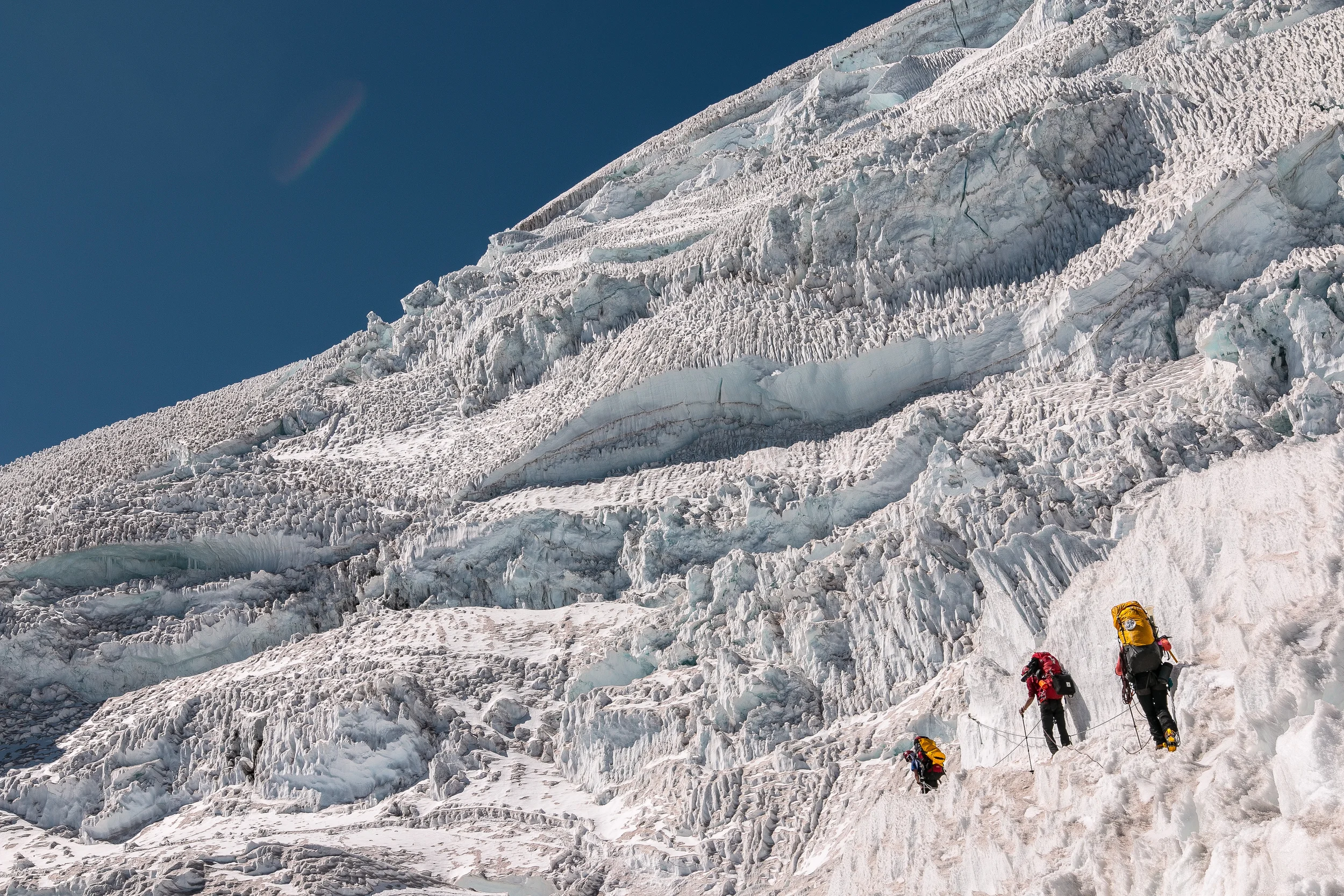 Making our way though the maze of glaciers with our 55-75lbs bags to the summit