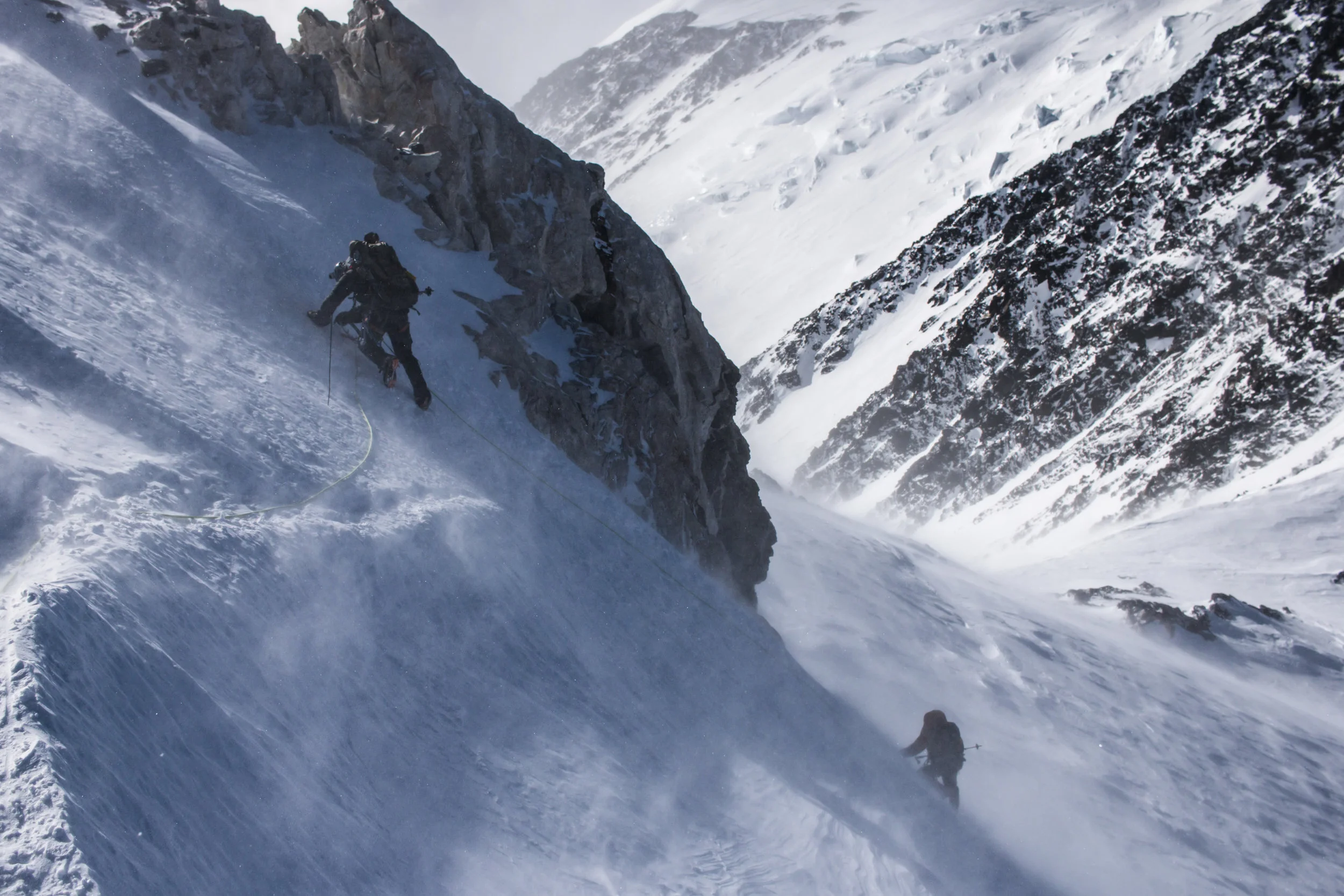 Down-climbing a steep section on Denali Pass.