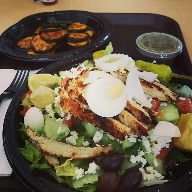 Eating a healthy chicken breast salad.. side zucchinis😋