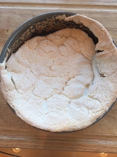 Baked torte will rise and fall leavinge crusty pieces around the sides.