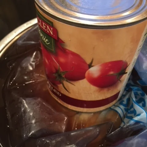 A large can on the top keeps the turkey under the marinade so it is completely submerged.