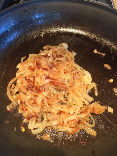 Caramelized onion are deep golden with some slices very dark brown. 