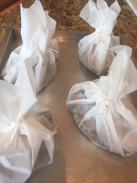 Salmon and sauce In parchment ready to bake.
