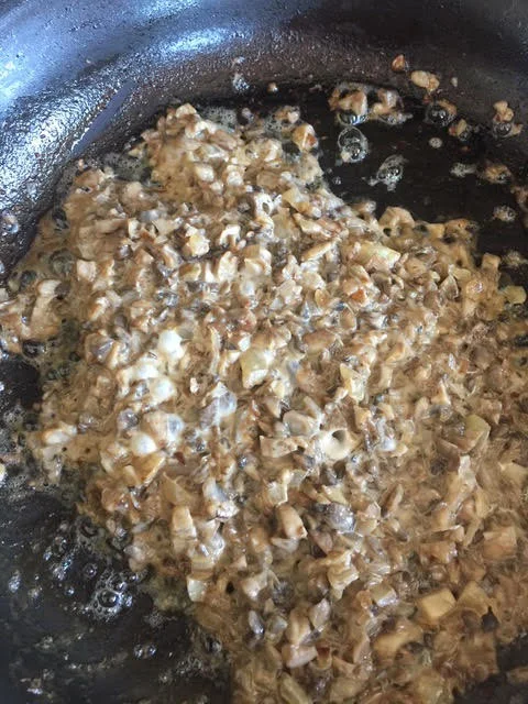 Reduce the cream until the mushrooms become creamy and the sauce lightly coats the bottom of the skillet. 