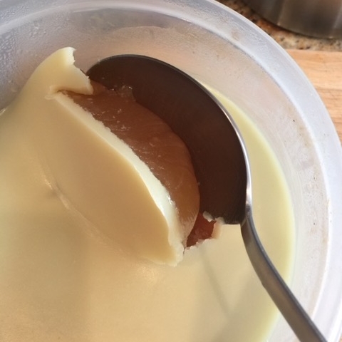 After being refrigerated, it is easy to scrape the hardened fat off the top. The soup underneath will be gelatinous and full of flavor.