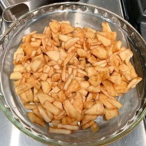 Microwave the remaining apples in a pie dish.