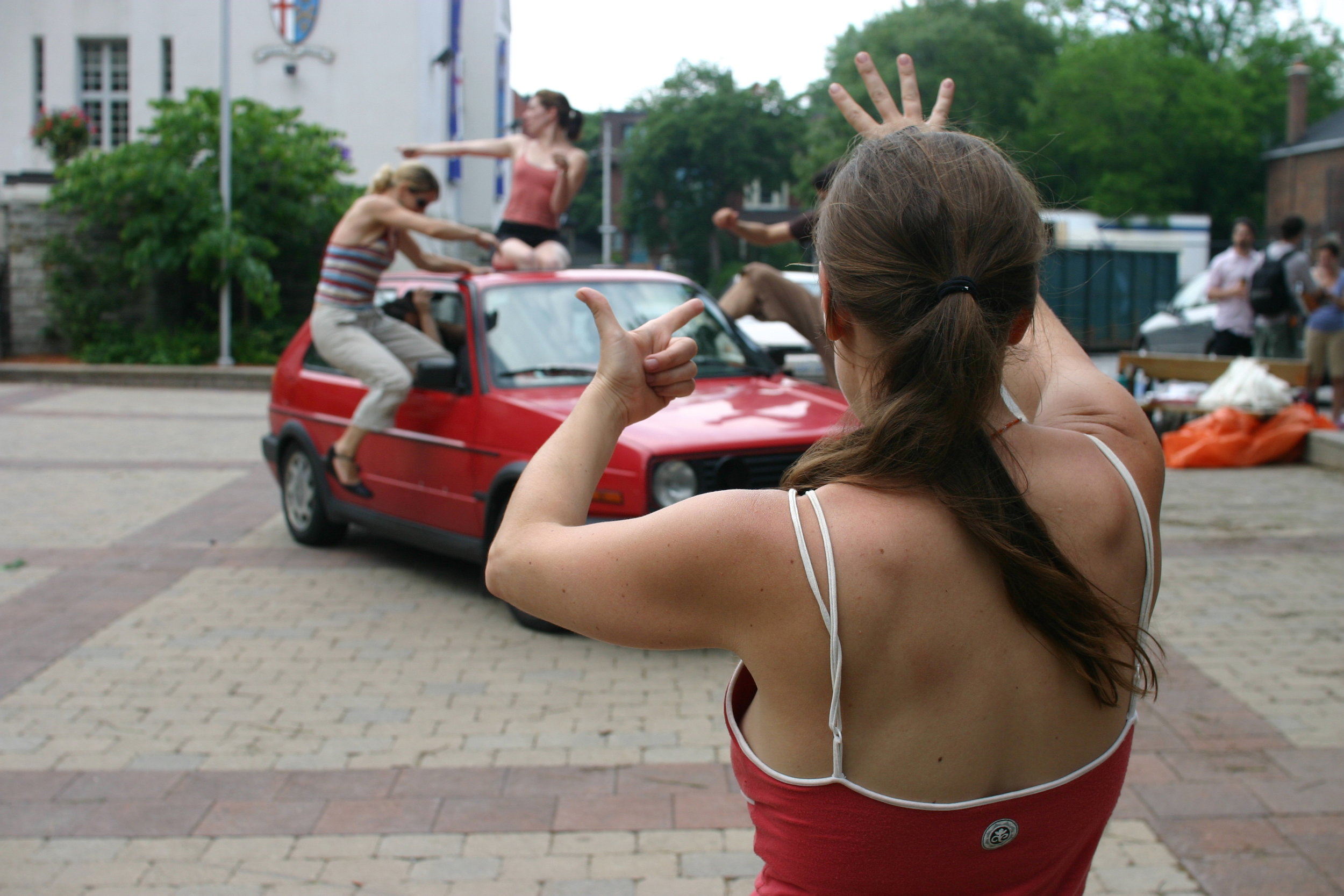  Choreographer Allison Cummings staging the opening number with the AutoHosts 