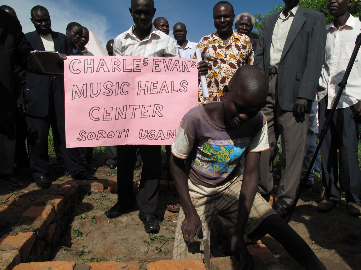 The young man lays his own bricks.