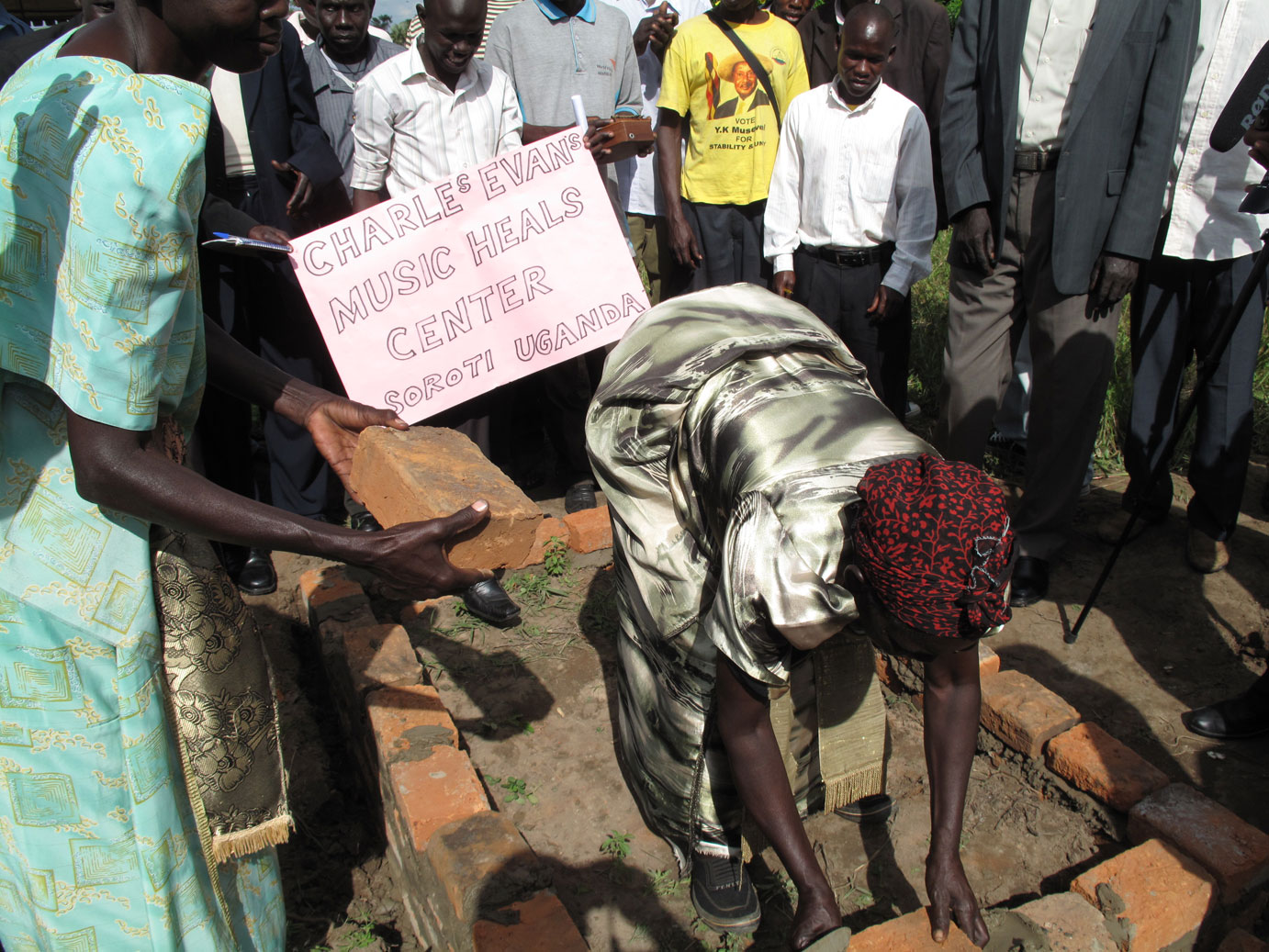 A village mother sets her contribution in place.