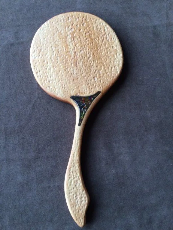 Back of hammer-peen mirror with insert