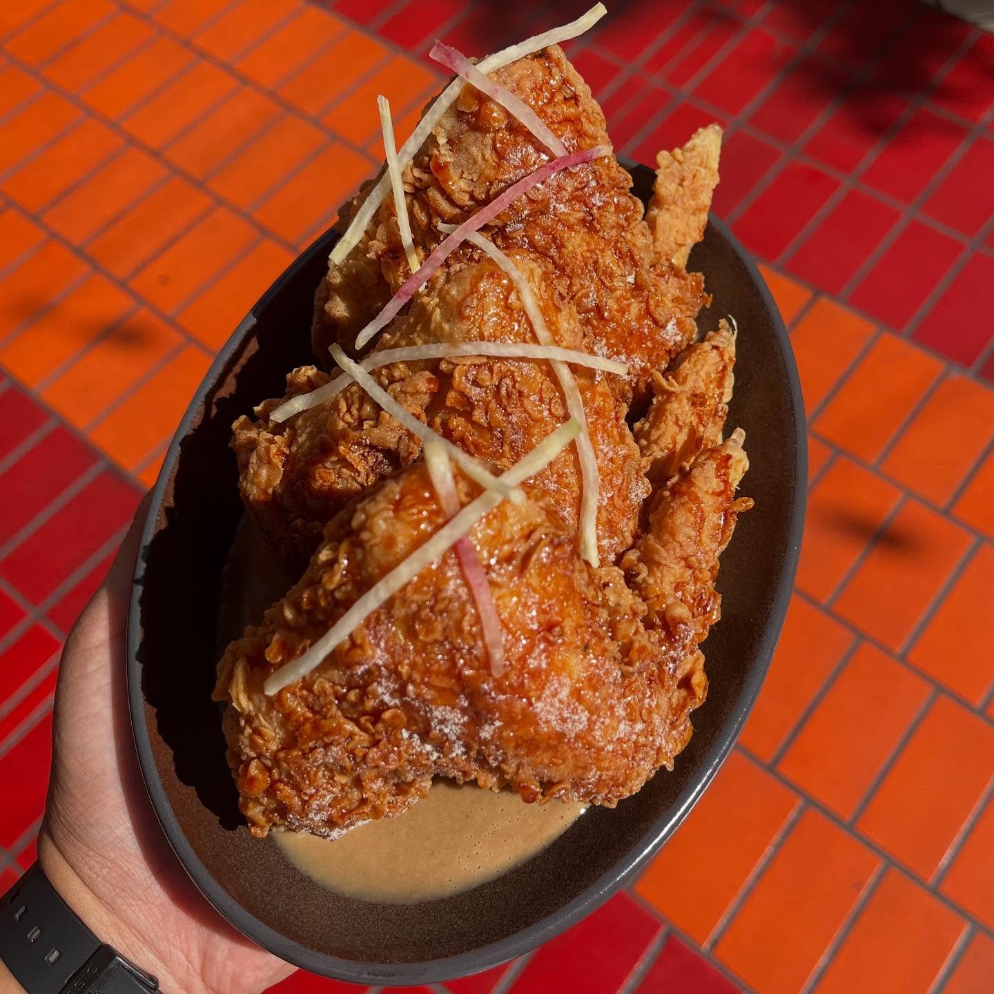 SINIGANG CHICKEN WINGS

fish sauce glaze ~ sinigang powder ~ black garlic gravy

~

Well, we did it y&rsquo;all. You all demanded we keep running our Sinigang Fried Chicken. We found a happy medium, and turned them into WINGS! They&rsquo;re on as a s