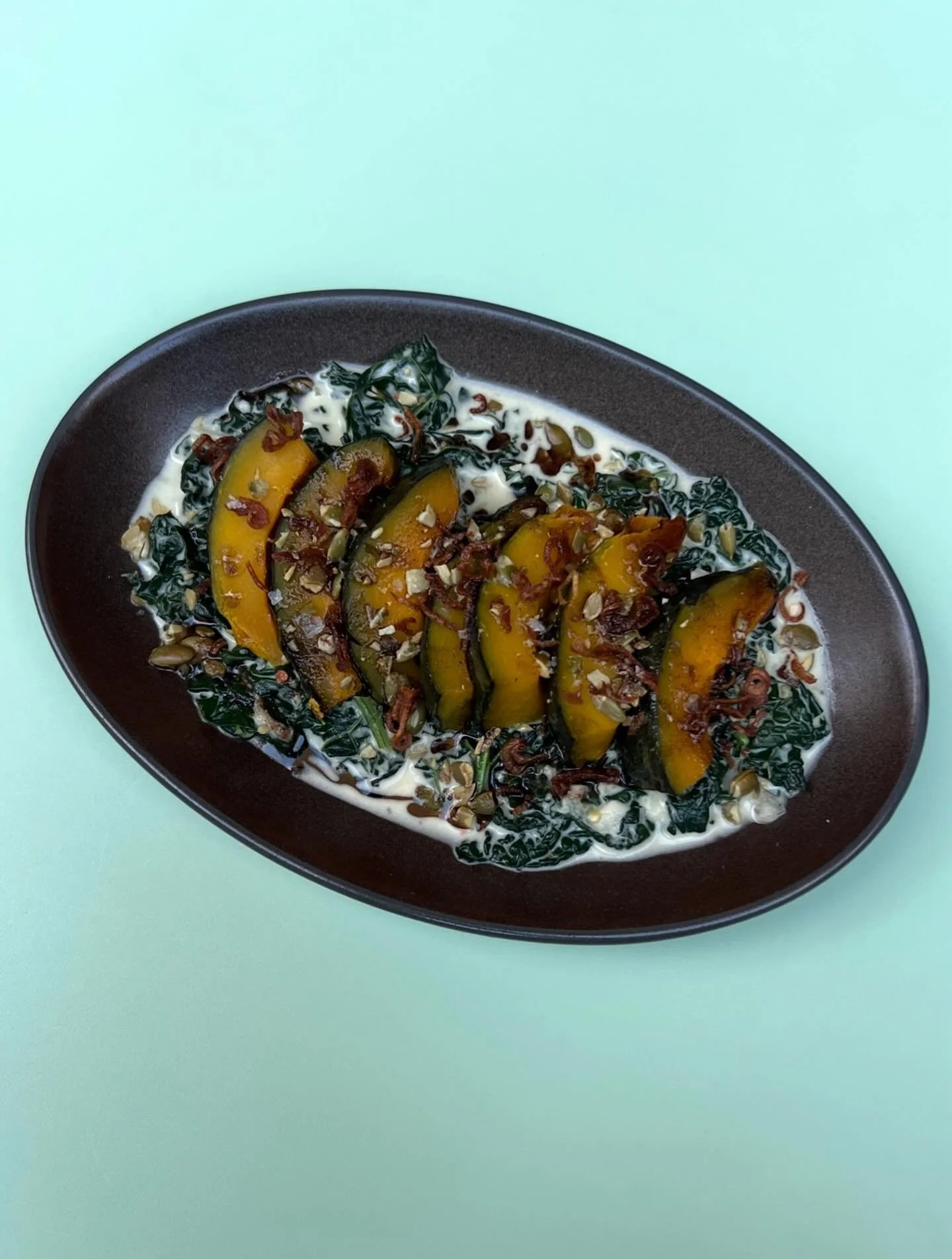 GINATAANG KALABASA&thinsp;&thinsp;
&thinsp;&thinsp;&thinsp;
kabocha ~ kale laing ~ burnt coconut oil ~ pepitas &thinsp;
&thinsp;
the coziest vegetable dish on the table. 5:30-10pm🍴