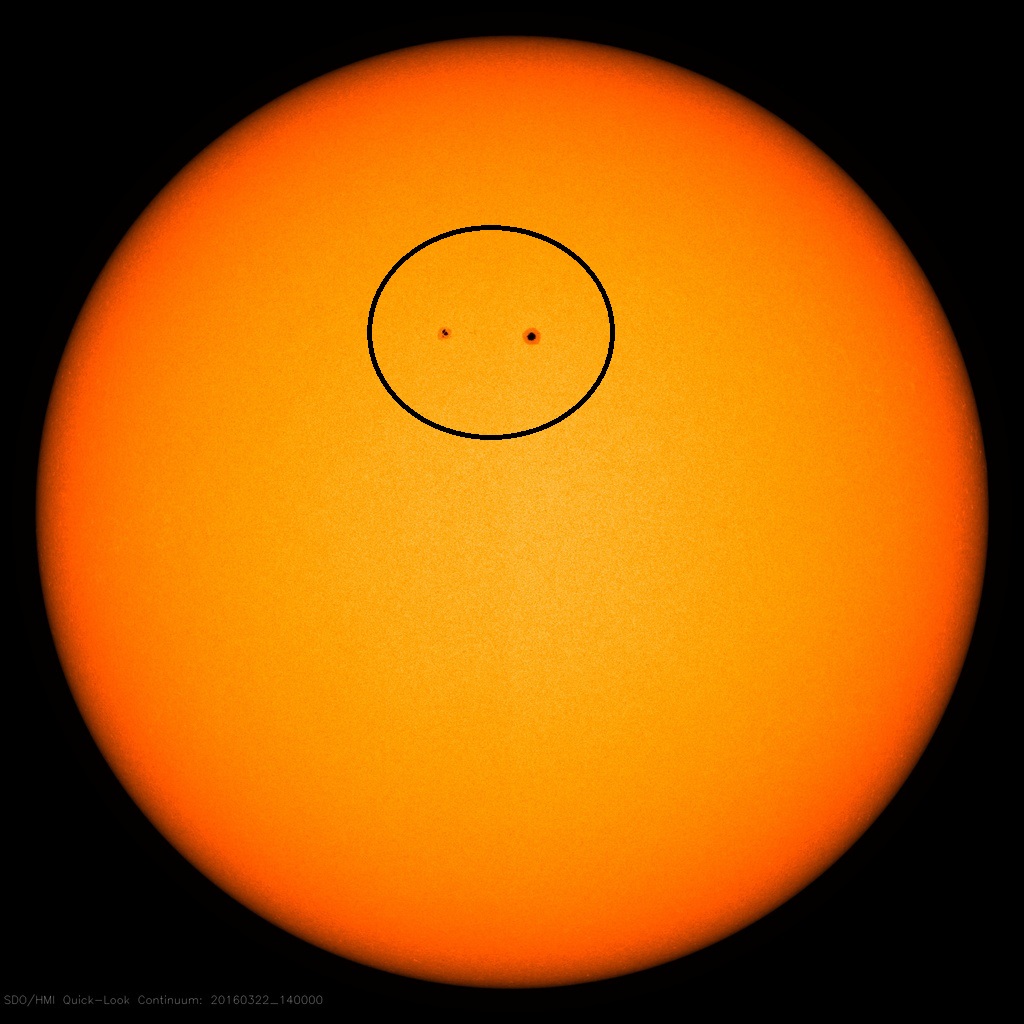 Current solar image with two visible sunspot regions: image courtesy NASA