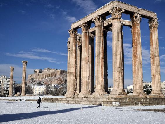The archaeological site of Olympion Zeus in Athens, Greece after rare snowfall on the city (10 January 2017); image courtesy AFP/Getty Images