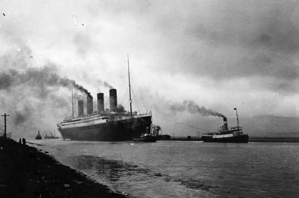 The SS Titanic being pulled by tugs as it is leaving Belfast, Ireland shortly before her disastrous maiden voyage of April, 1912