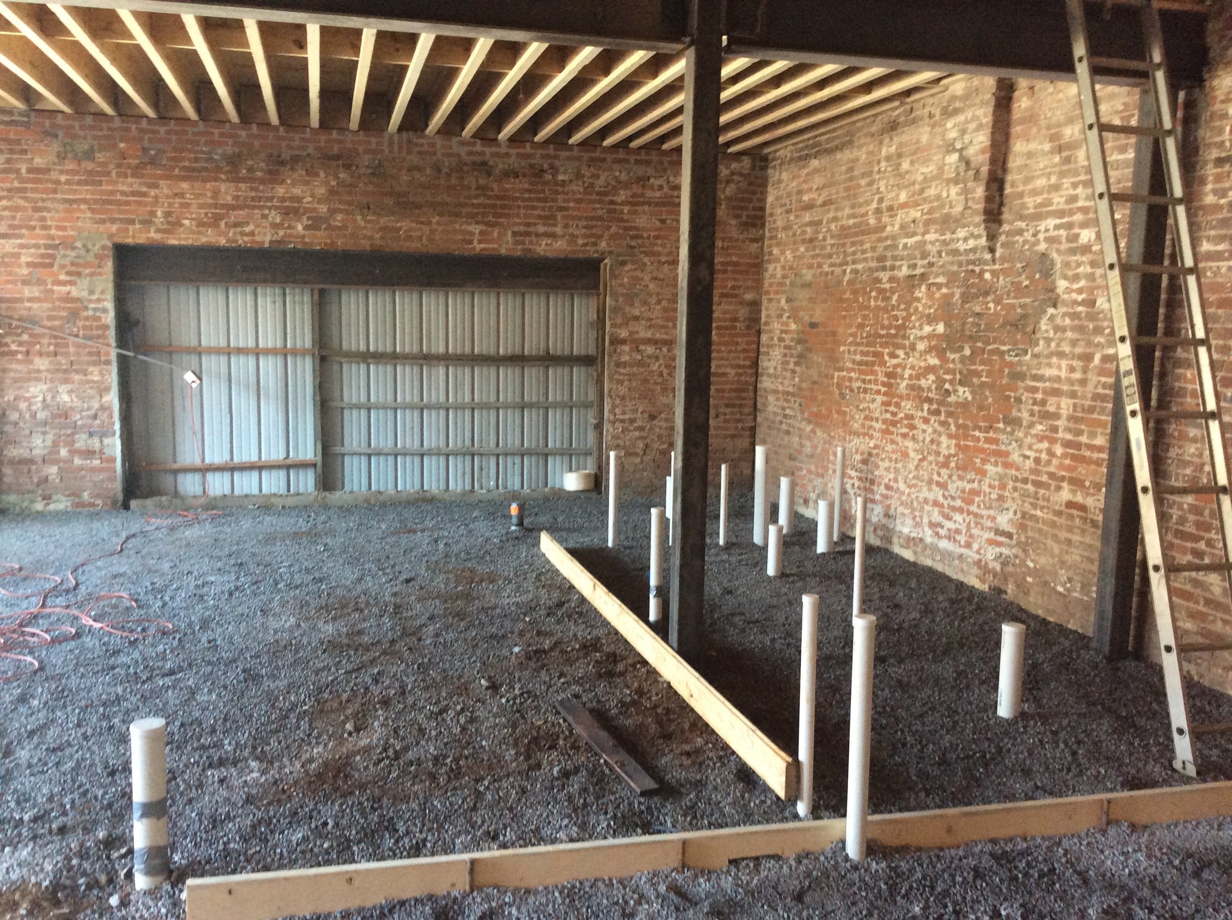  New plumbing in place, ready for the new floor. There will be a large window in the far wall, overlooking Main St. 