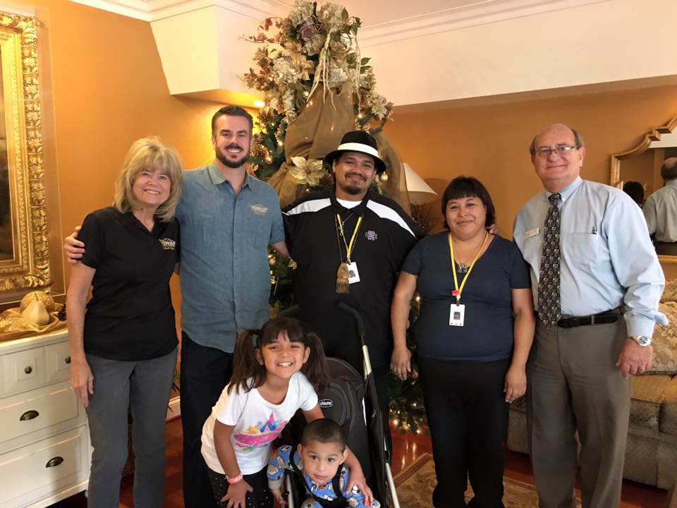 Owner and President, Ben Cook stands with his mother and a family living in the Ronald McDonald House in Loma Linda.