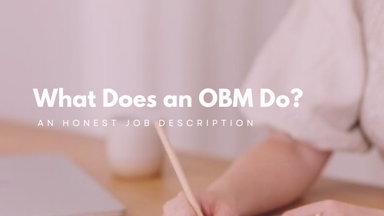Woman writing at her desk, representing what an online business manager does in her daily role