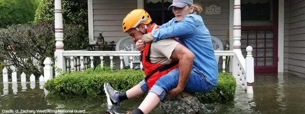 From PDA: A Texas National Guardsman carries a resident from her flooded home following Hurricane Harvey in Houston.