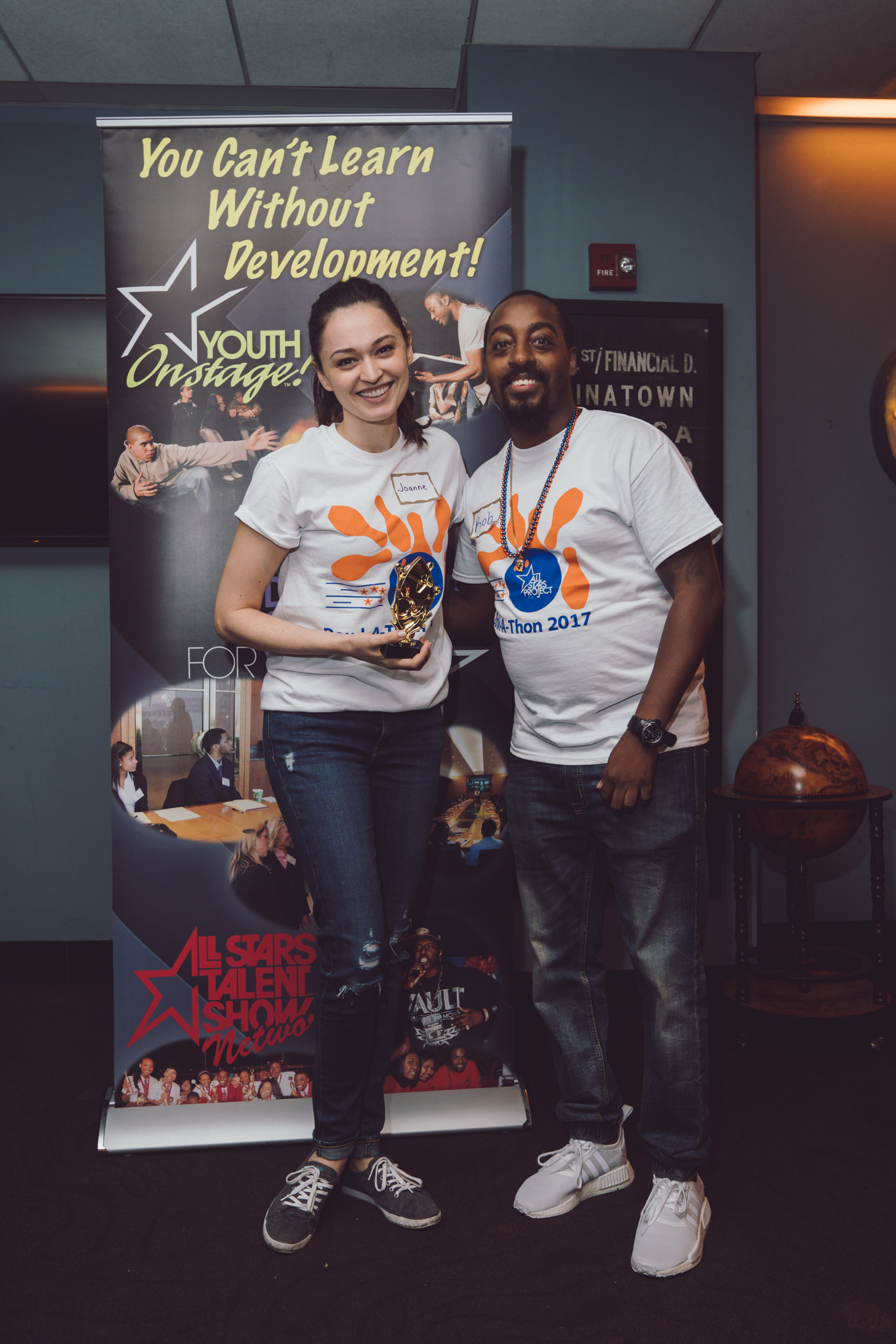  Celebrating high fundraising numbers at All Stars Project's annual Bowl-A-Thon fundraising event. Photo by Daniel Lee. 