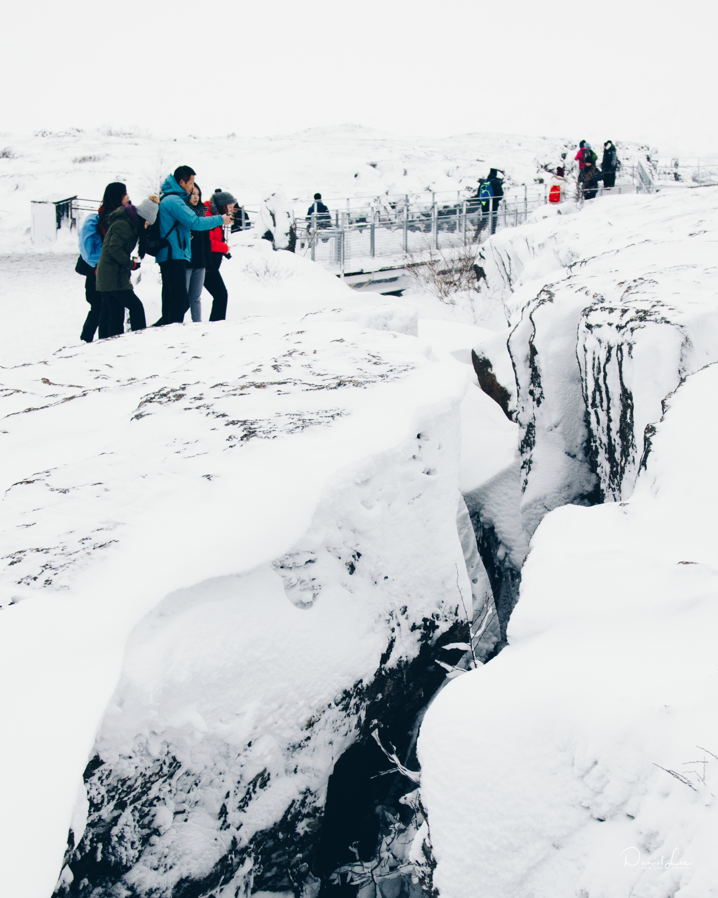  Tourists observe the separation between the North American tectonic plates and "new" earth created between the North American plate and the Eurasian plate. Iceland. Photo by Daniel Lee. 