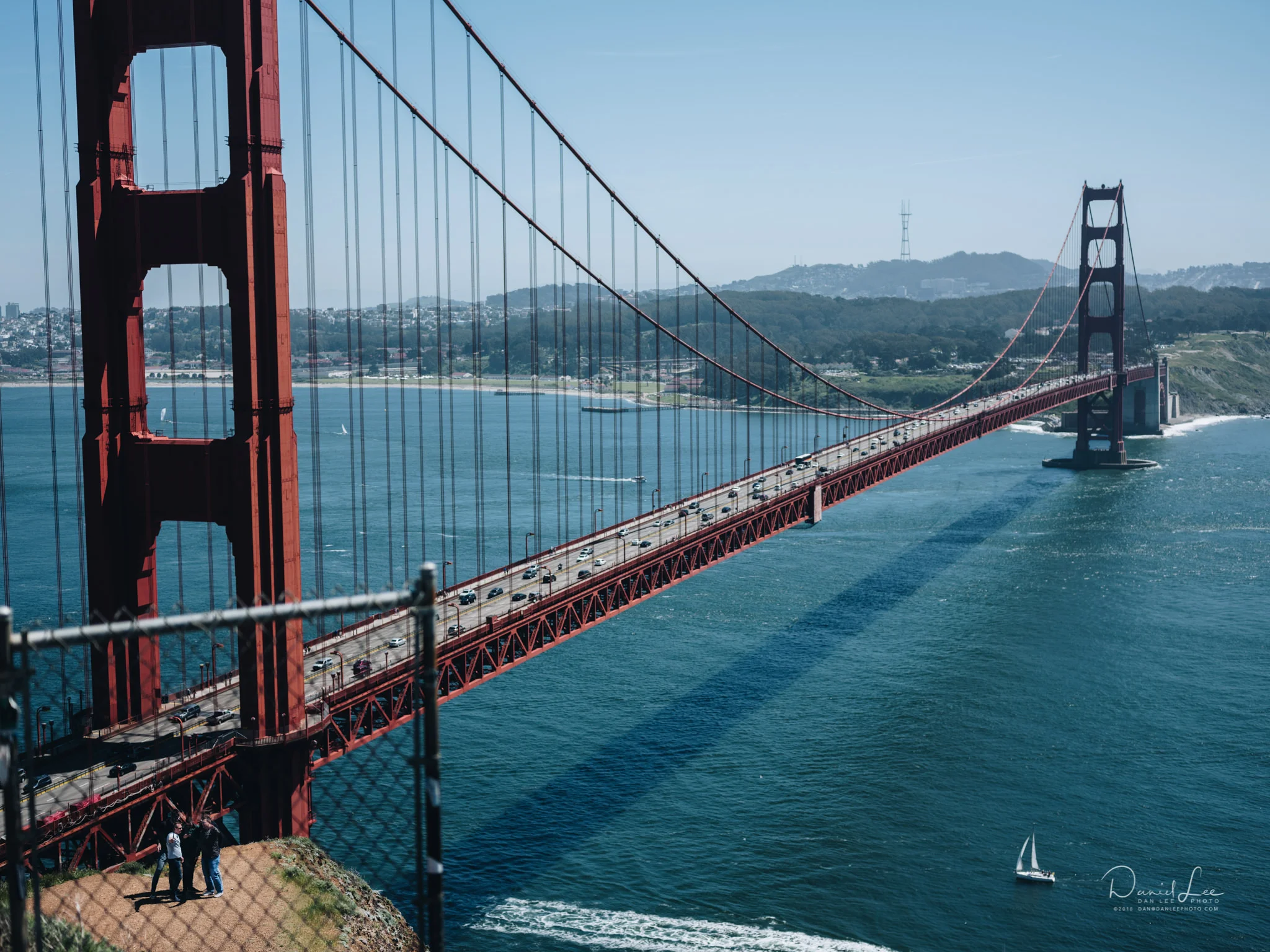 Tourists trespassing on land marked “Do Not Enter” near the Golden Gate Bridge to capture a group selfie. Photo by Daniel Lee.