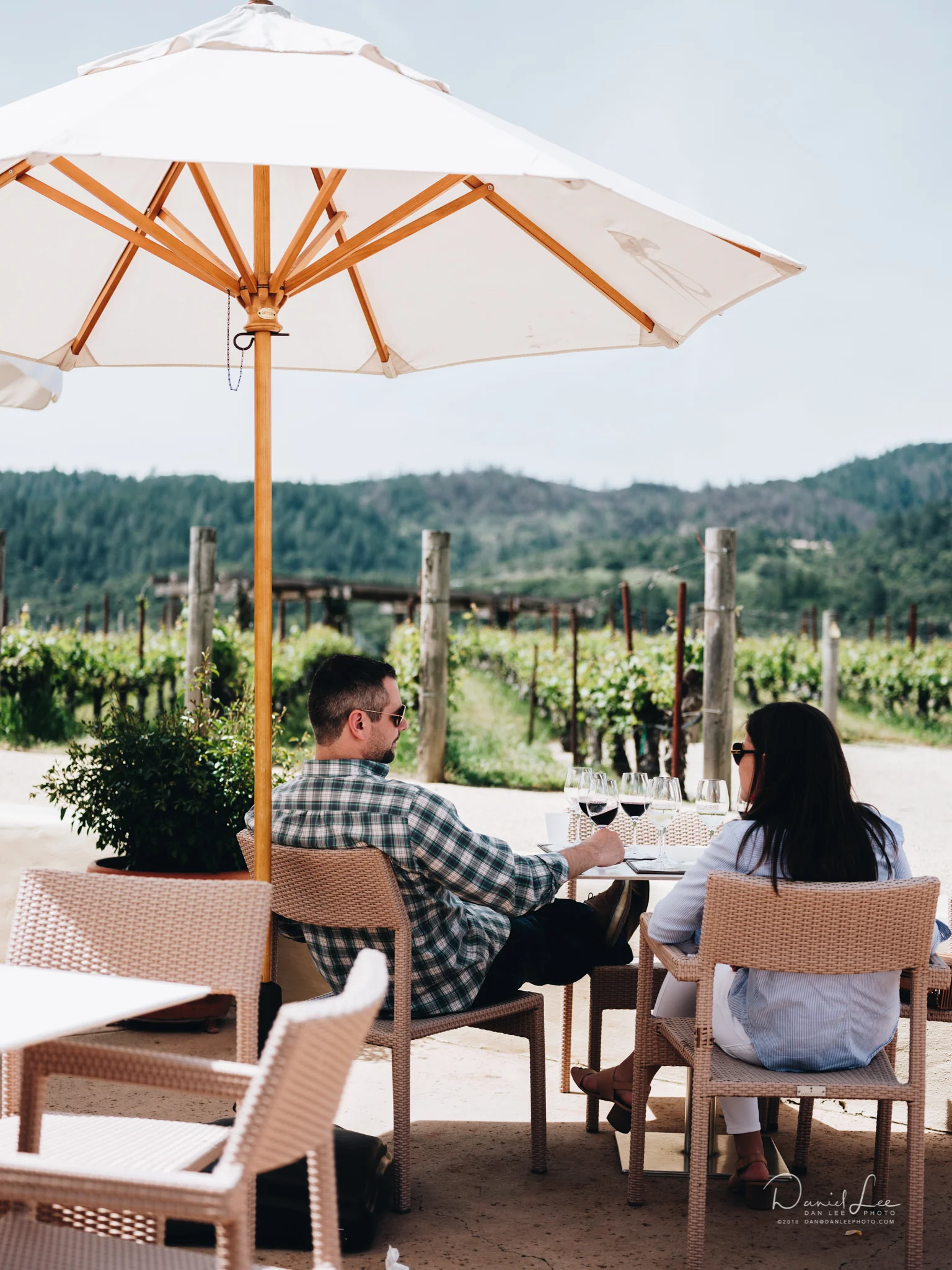 A couple enjoys wine tastings at Robert Mondavi Winery in Oakville, CA. Their Cabernet Sauvignon Reserve is extraordinary. Photo by Daniel Lee.