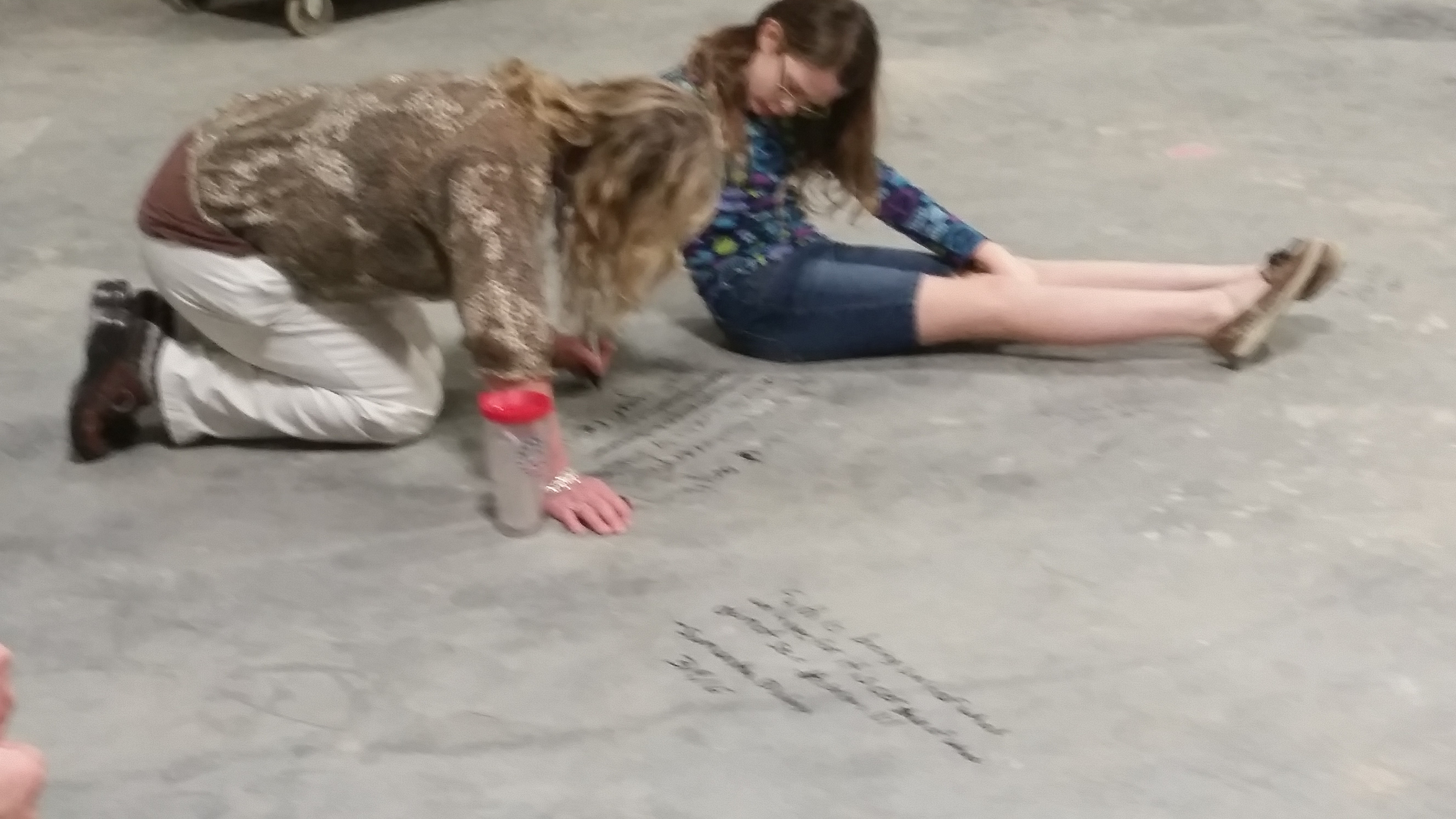 Girls Writing Floor.png