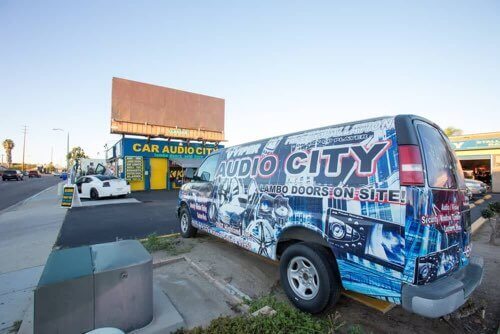 Check Out Our Wrapped Van in Front of Our Shop
