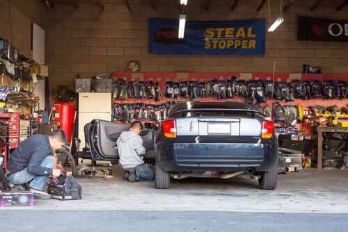 Our Technicians Working on a Car at Our National City Shop