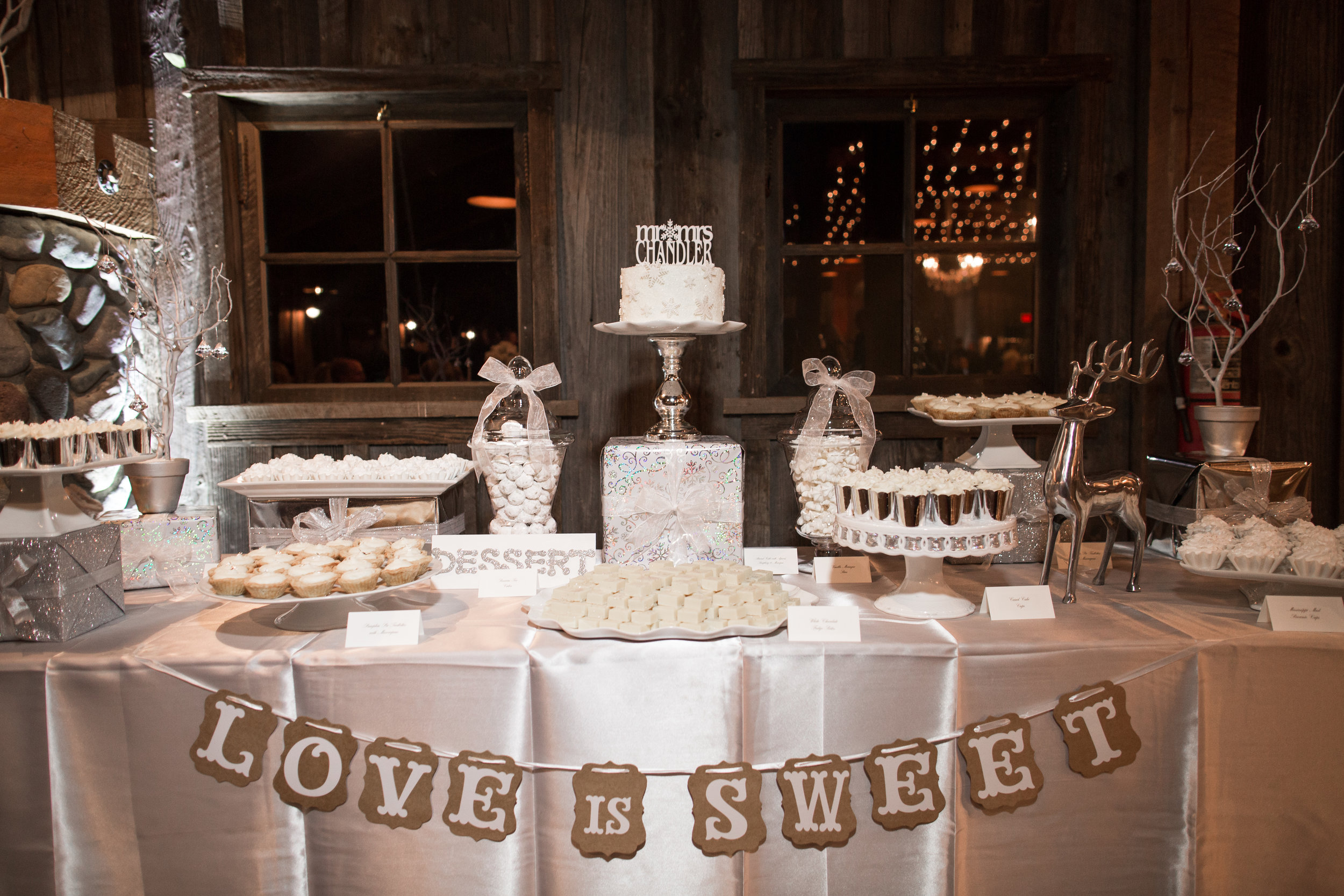 All White dessert table for Angela + George's December Wedding. Photo by Corliss Photography.