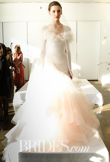 Ivory and blush ombré off-the-shoulder gown with hand-draped push-up bodice, 3-D floral embellished neckline and ombré tiered circle draped skirt, Marchesa