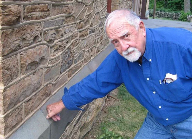 Wayne inspecting the lead mortar of the foundation stones at Olana a few years ago. Photo by George Peacock.