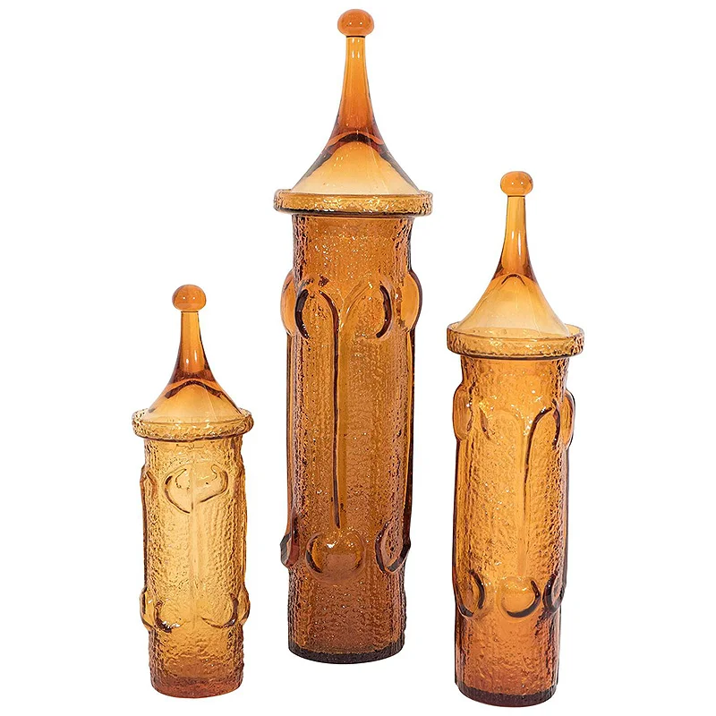 Three Antigua jars in amber.