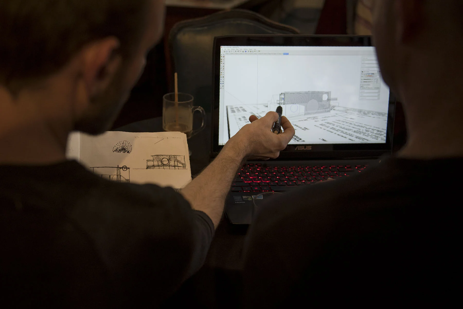 Mat Chandler, the owner of Aurora Healing Arts center in Gainesville, points at a design for a float center. The center, which will have a café and use repurposed shipping containers as rooms for the floating pods, is set to open in August.