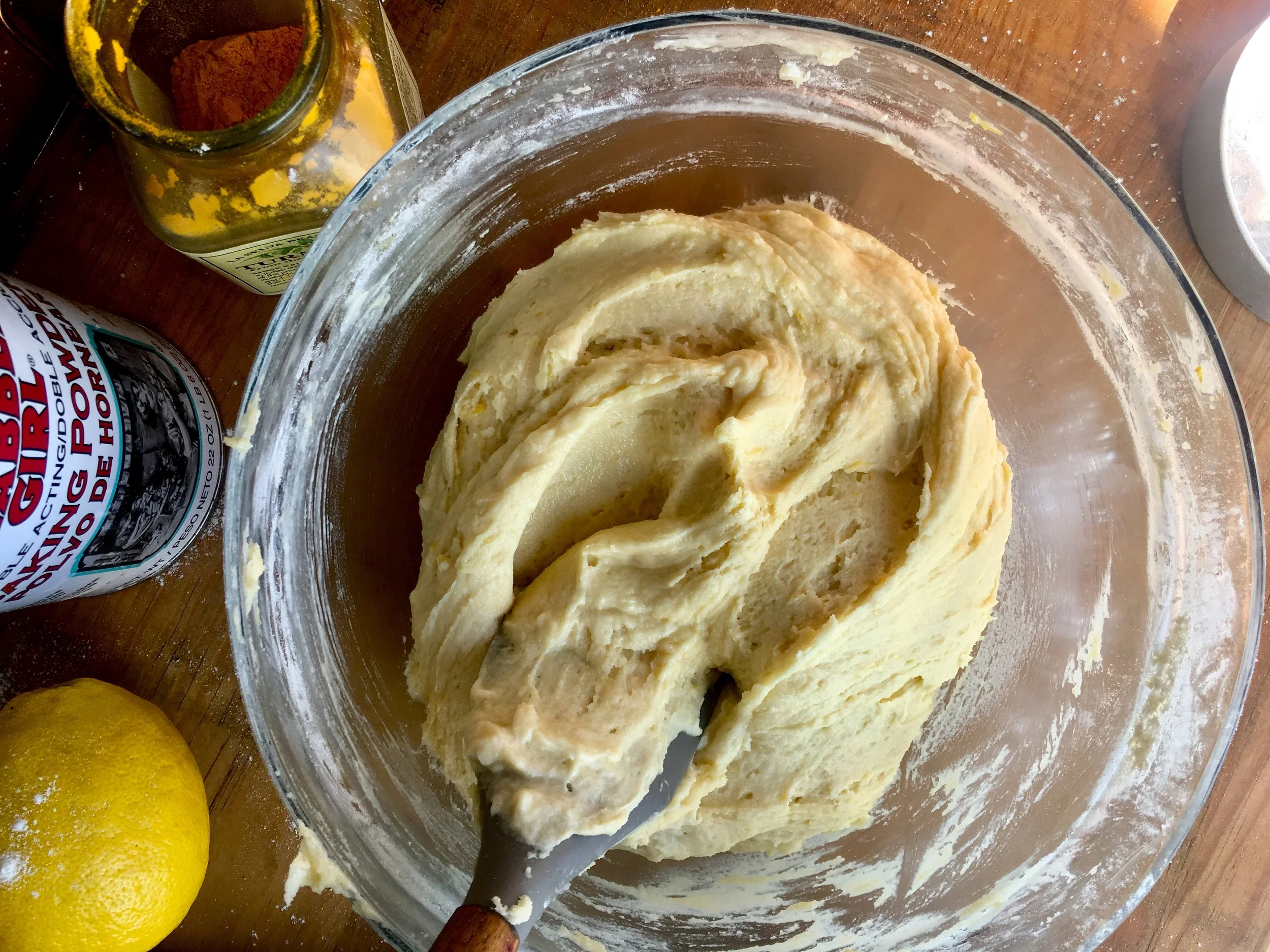 Sift in turmeric after other dry ingredients have been thoroughly mixed in.