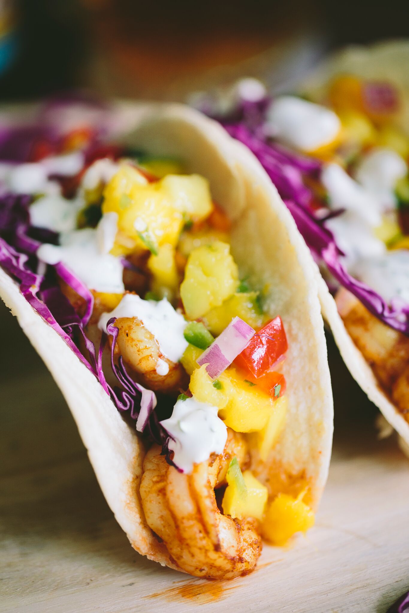 SHRIMP TACOS WITH MANGO SALSA + CILANTRO LIME CREMA