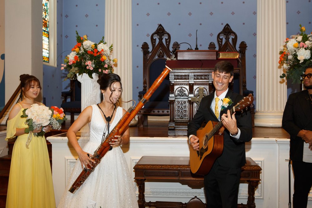  Hanul and her husband, Luke, perform at their August 2023 wedding as part of their unity ceremony.  