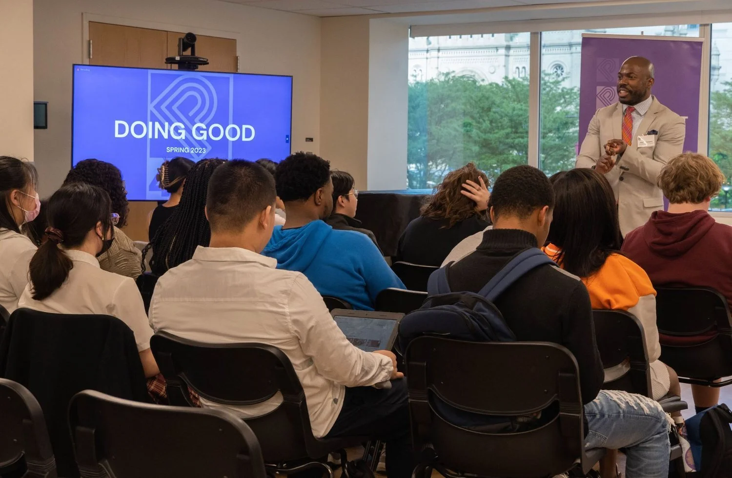 Joseph Conyers speaks with Project 440 students at a Doing Good graduation