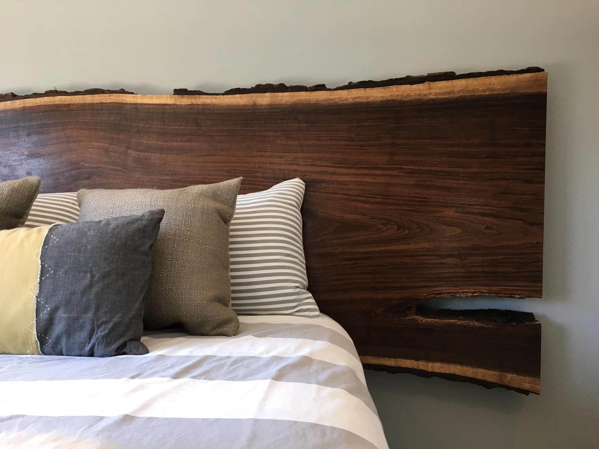 Black walnut queen or king headboard mounted to steel legs. Headboard by American Arborist, legs by Integral Iron