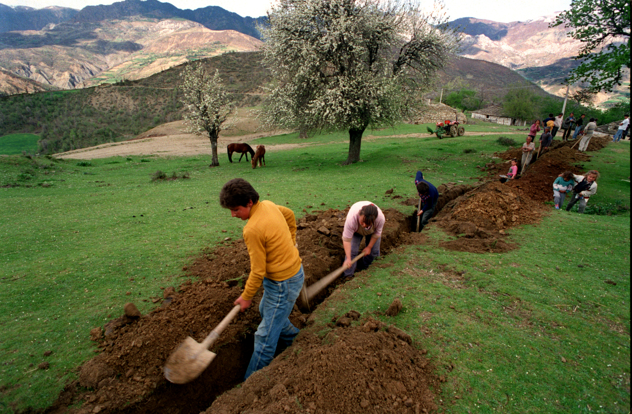  In the isolated, mountainous village of Jeronisht, the materials are funded by Diaconia Agapes, but the villagers do the work themselves on the water project. ©Gail Fisher Los Angeles Times 