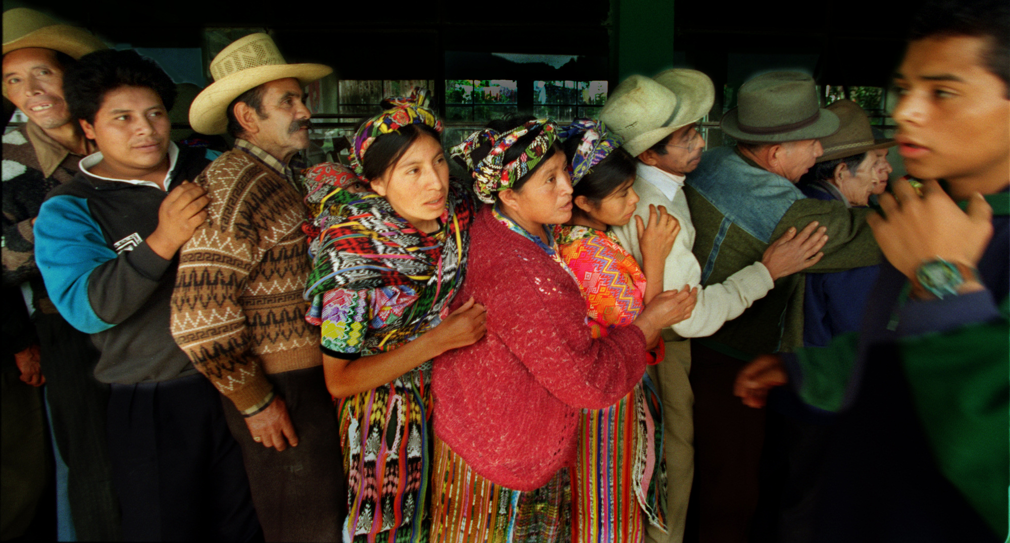 Villagers dressed in the intricately woven clothing of the Mam and Quiche Indians lined up dozens deep to have their eyes examined by the Xela Aid team of doctors. ©Gail Fisher Los Angeles Times