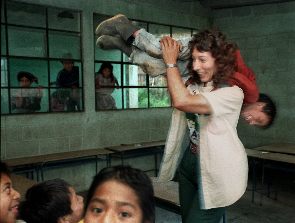 The Xela Aid rules are clear: no politics, no religion, no colonizing. She is not a missionary and will allow no one in Xela Aid to be, kicking out one volunteer who promised villagers an evangelical church. She enjoys clowning around with the village children. ©Gail Fisher Los Angeles Times