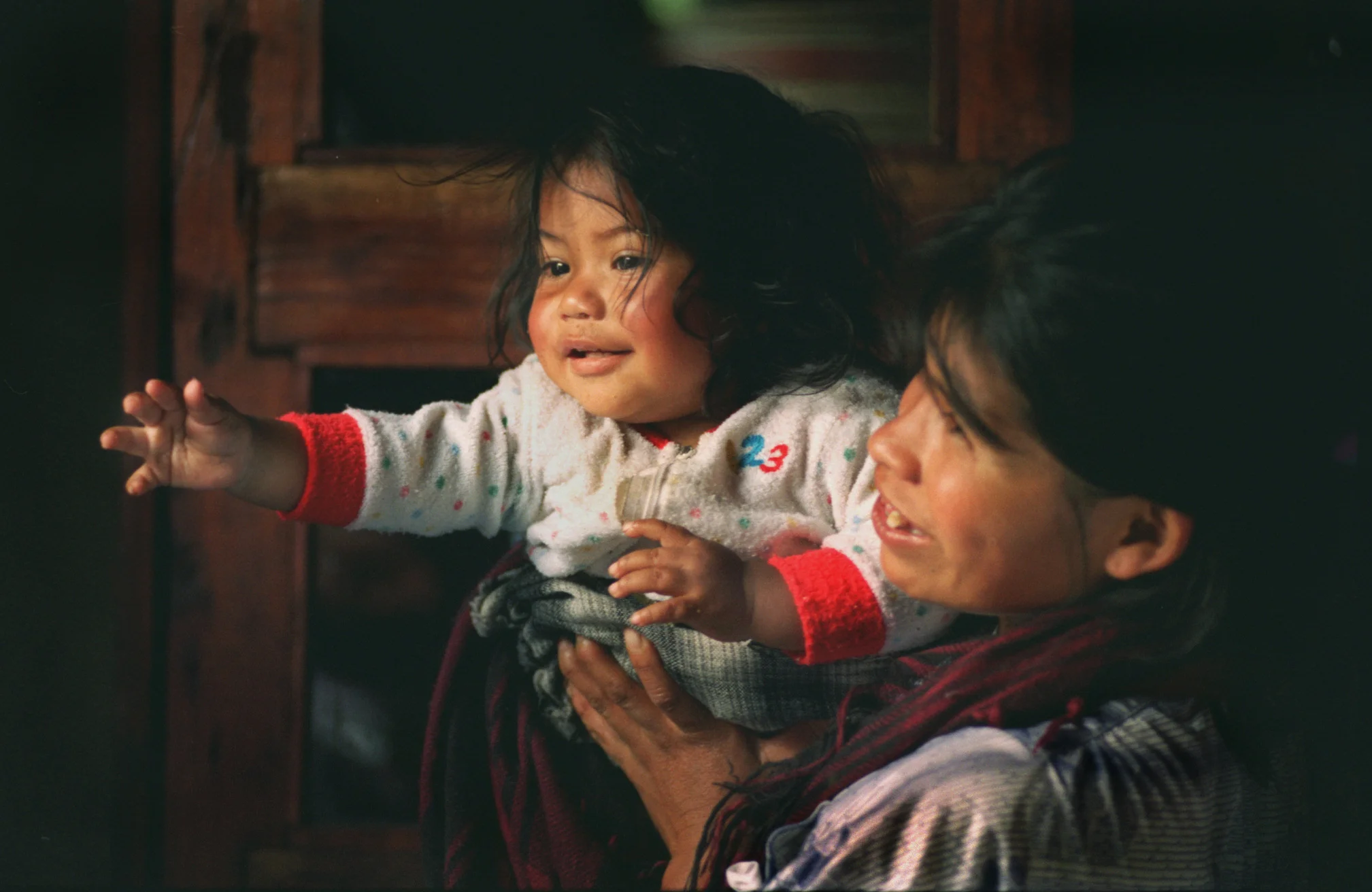 One-year-old baby Ana Victoria Hernandez in the arms of her mother Rosario Monroy, 25 are some of the lucky ones. The thirty some year civil war has claimed an estimated 150,000 lives, and caused another 40,000 people to ‘disappear,’ most of them peasants. ©Gail Fisher Los Angeles Times